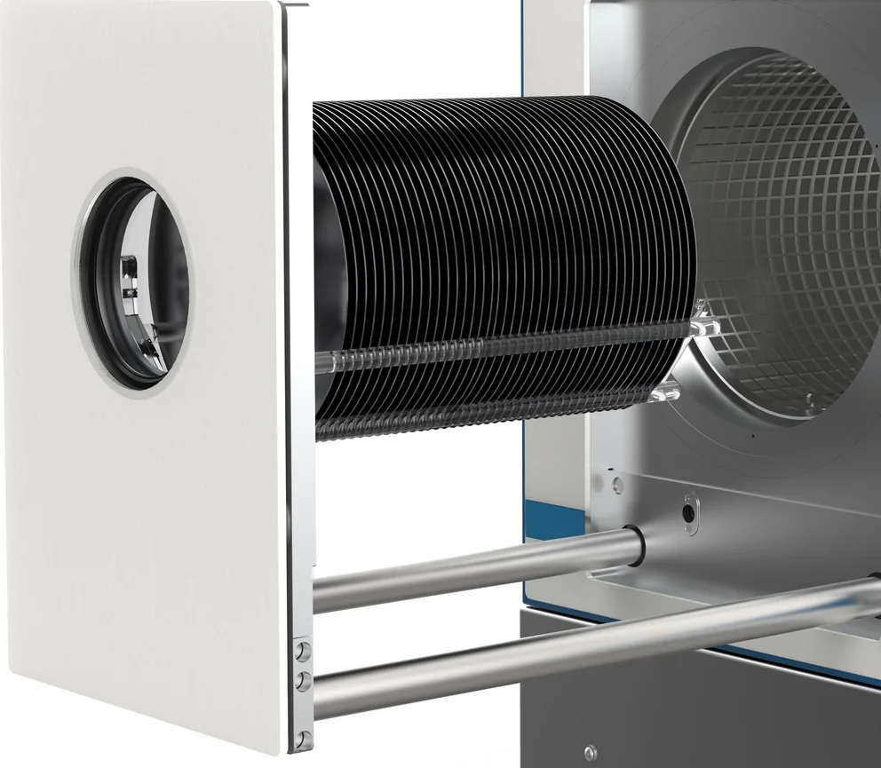 Interior of a plasma frontend showing multiple wafers being inserted into a cylindrical holder.