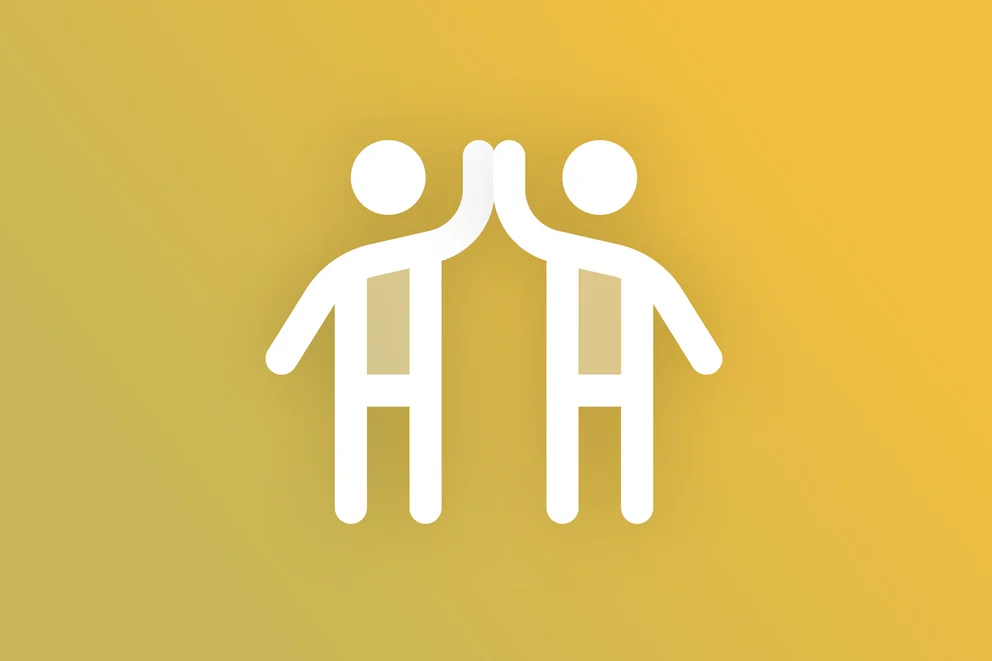 Icon of two people giving a high‑five on a yellow background.