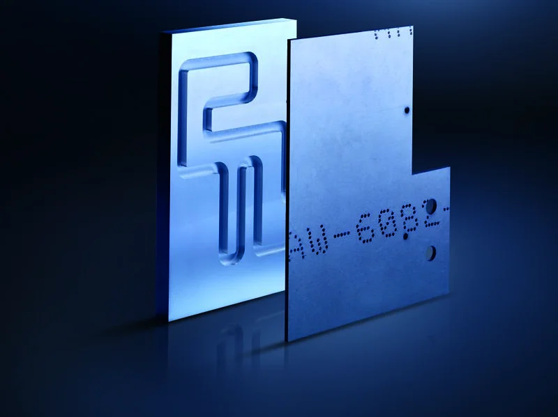 Two metallic components with engraved markings produced by precision diffusion bonding technology.