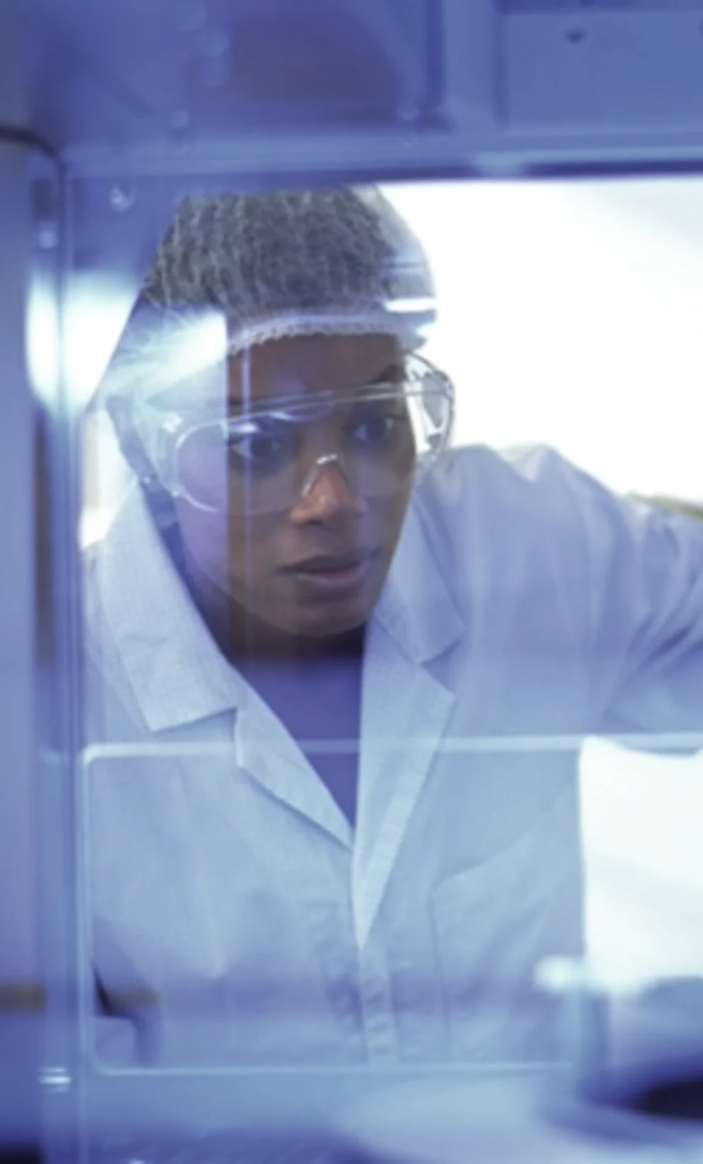Person inspecting equipment in a lab environment