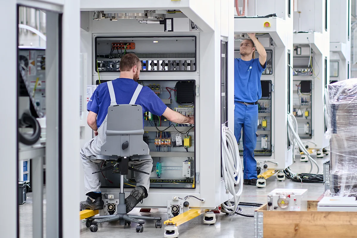Technicians working on a SiCma system.