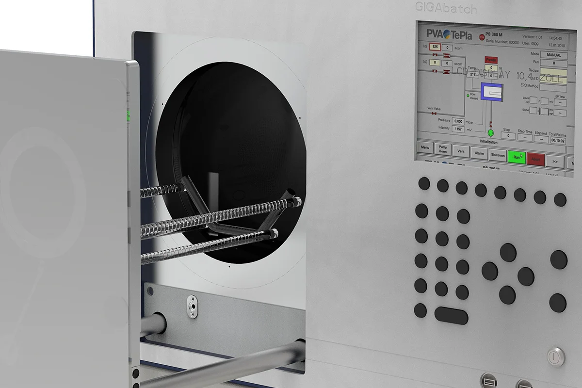 Gigabatch 380 detail view showing open circular chamber door and control panel.