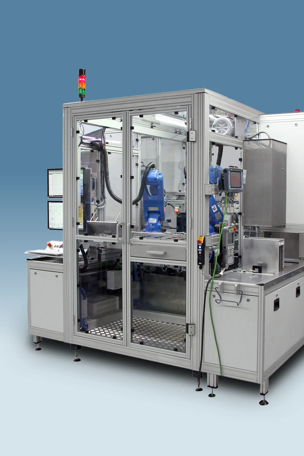 PVA TePla Auto-Tray system featuring an enclosed automated handling unit with robotic mechanisms for loading and transferring trays.