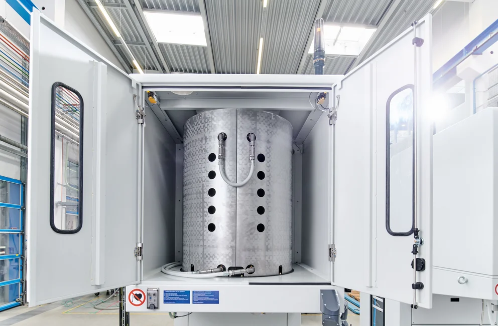 Interior view of a SiCma PVT crystal growth system with open chamber doors
