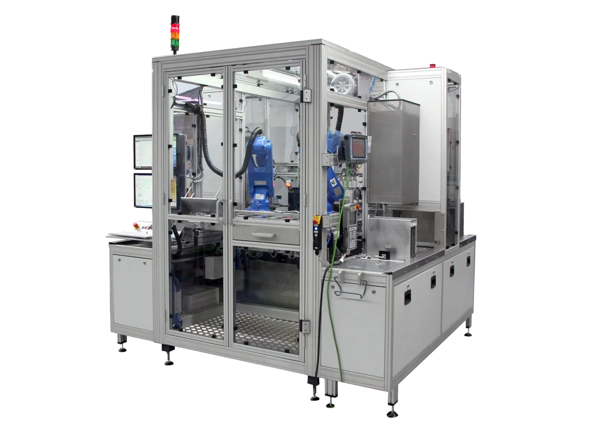 PVA TePla Auto-Tray system featuring an enclosed automated handling unit with robotic mechanisms for loading and transferring trays.