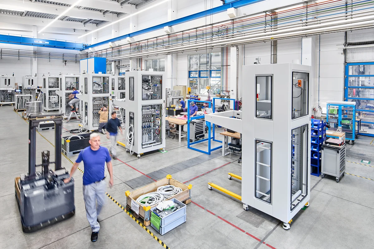 Production hall with technicians assembling SiCma PVT crystal growth systems