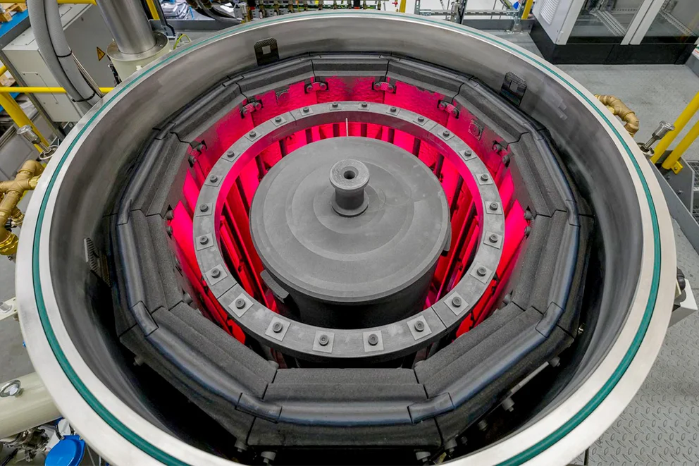 view into a graphite purification furnace showing the concentric heating elements glowing red